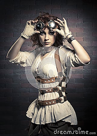 Redhair girl with steampunk goggles Stock Photo