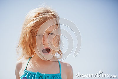 Child expresses dissatisfaction with shouts and emotions Stock Photo