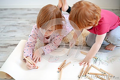 Children draw with colored pencils Stock Photo