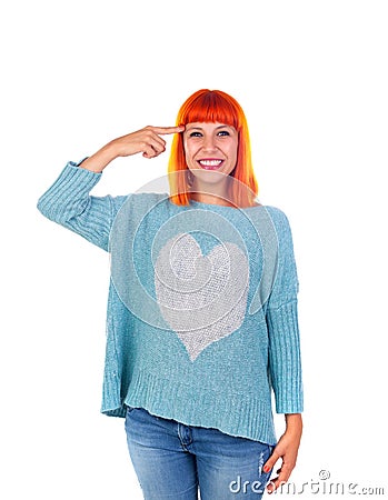 Redhead girl with blue jersey doing a signal of crazy with her f Stock Photo