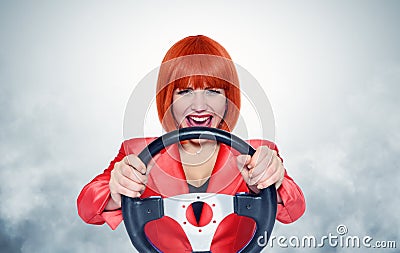 Redhead girl with car wheel and smoke Stock Photo