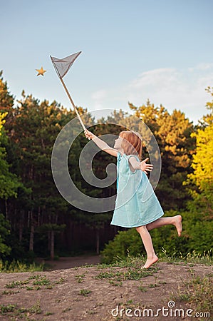 The girl is catching the star net Stock Photo
