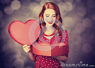 Redhead girl with gift for Valentines Day Stock Photo