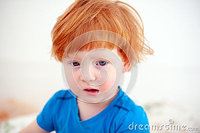 The kid just woke up and sick Stock Photo