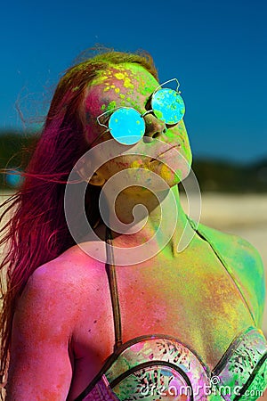 Holi girl on beach Stock Photo