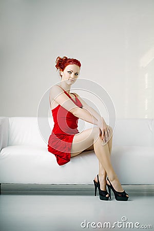 https://thumbs.dreamstime.com/x/redhead-woman-red-dress-white-couch-21874015.jpg