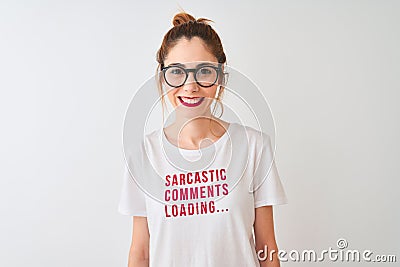 Redhead woman wearing funny t-shirt with irony comments over isolated white background with a happy face standing and smiling with Stock Photo
