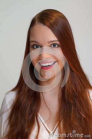 Redhead young woman seems very happy Stock Photo