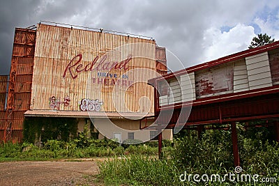 Redland, Texas - Abandoned Drive-in theater with dark clouds in Redland, Tx, a small community along US Highway 59 Editorial Stock Photo