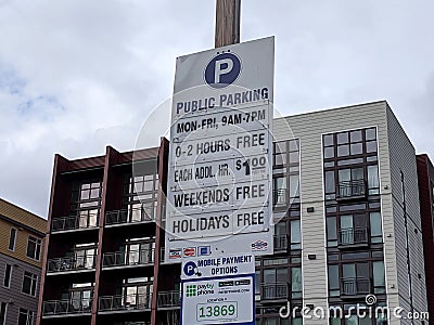 Redmond, WA USA - circa March 2021: Low angle view of public parking rates in a lot near downtown Redmond Editorial Stock Photo