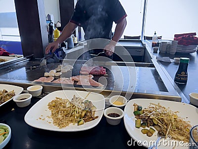 Redmond, WA USA - circa May 2023: Selective focus on a hibachi dinner being prepared inside a Japanese restaurant Editorial Stock Photo