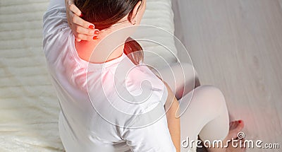 Redness and pain in the neck of a pregnant girl. Overstrain of the neck muscles, myofascial syndrome. Copy space for text Stock Photo