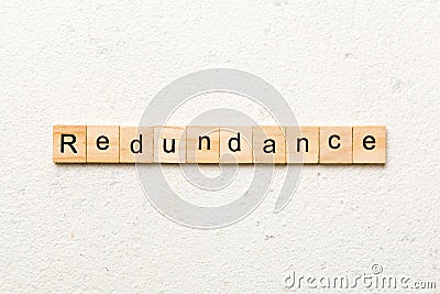 redundancy word written on wood block. redundancy text on table, concept Stock Photo