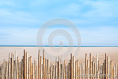 Reed fence bamboo on empty beautiful beach Stock Photo