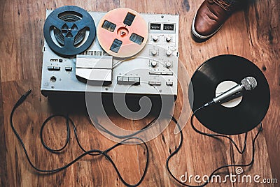 Reel tape recorder with microphone. Retro music. Disco party Stock Photo