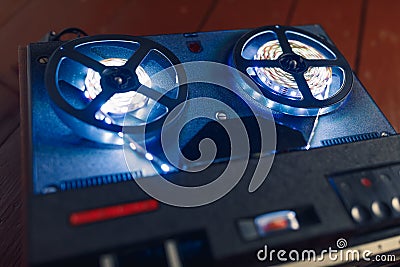 Reel to reel audio tape recorder with blue led light strip Stock Photo