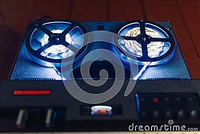 Reel to reel audio tape recorder with blue led light strip Stock Photo