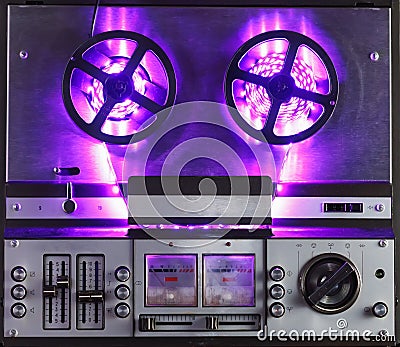 Reel to reel audio tape recorder with purple led light strip Stock Photo