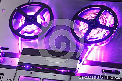 Reel to reel audio tape recorder with purple led light strip Stock Photo