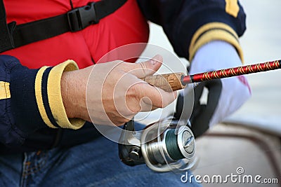 Reeling in a Fish Stock Photo