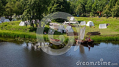 Reenactment of Bourtange 1650 army camp outside of the city with an old boat in the river Stock Photo