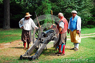 Reenactors demonstrate the firing of a cannon Editorial Stock Photo