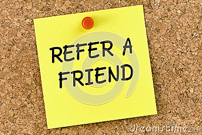 Refer a friend PostIt Note Pinned To Cork Board or corkboard Stock Photo