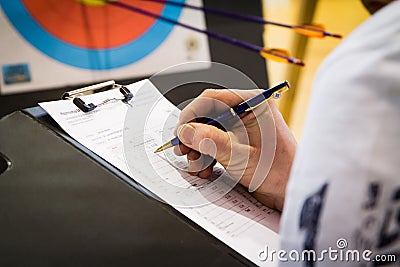 Referee Keeping Score in Archery Stock Photo