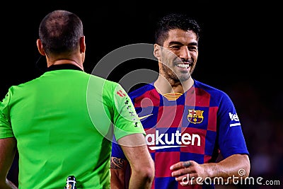 The referee Mateu Lahoz (L) disusses with Luis Suarez (r) Editorial Stock Photo