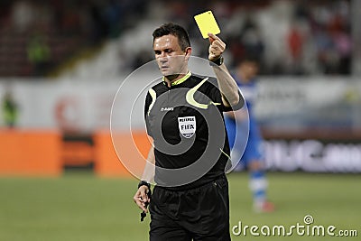 Referee shows the yellow card Editorial Stock Photo