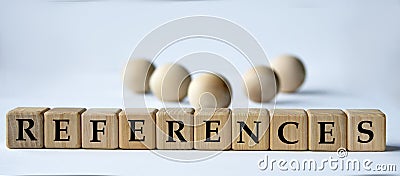 REFERENCES - word on a wooden block on a white background with wooden balls Stock Photo