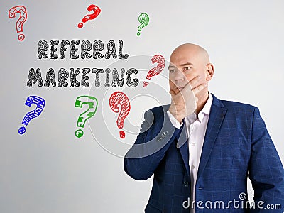 REFERRAL MARKETING question marks phrase on the side Stock Photo