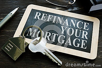 Refinance your mortgage word on the small blackboard. Stock Photo