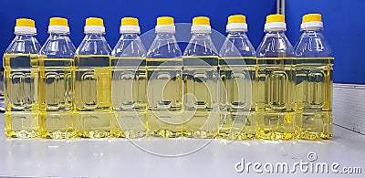 Refine soybean oil bottles were displayed on the table. It looks yellowish color. Stock Photo