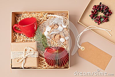 Refined Christmas care box with coffee cup, gift and xmas ornament Stock Photo