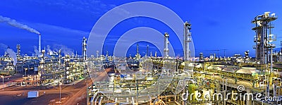 Refinery - chemical factory at night with buildings, pipelines and lighting - industrial plant Stock Photo