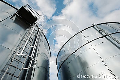 Refinery ladder and tanks Stock Photo