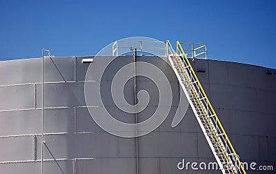 Refinery Plant Tank Storage with Ladder Stock Photo