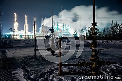 Refinery and wellhead Stock Photo