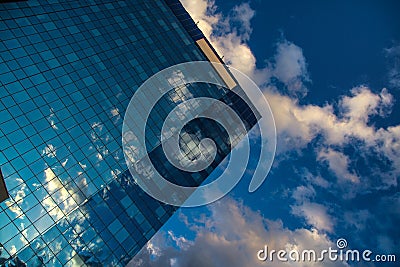 Reflected clouds in the mirror of skyscrapper Stock Photo