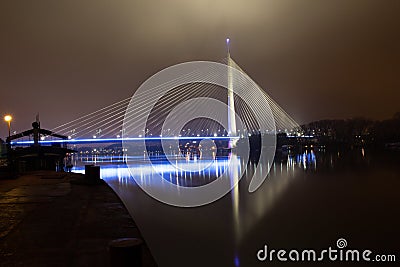 Reflection of Ada bridge and ship on Sava river Stock Photo