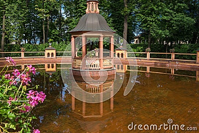 Reflection of the arbor in the water of the pond Editorial Stock Photo