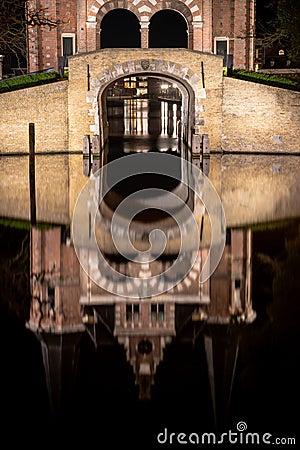 Reflection of the beautiful brick building of Waterpoort Gate in the harbor Stock Photo