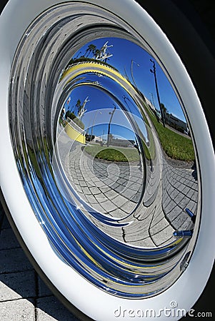 Reflection in car hubcap Stock Photo