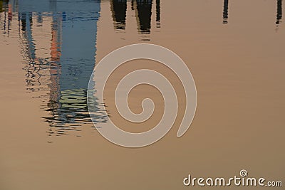 Reflection of the conning tower of a mud tugboat in the sunset w Stock Photo