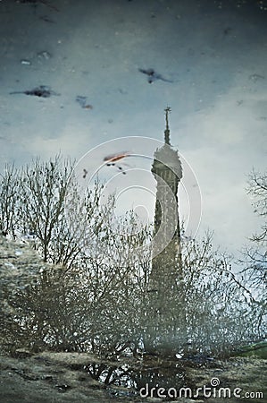 Reflection of the Eiffel tower in a puddle Stock Photo