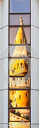 Reflection of Fisherman`s Bastion, aka Halaszbastya, fairy tale towers in modern hotel windows. Architectural contrast Stock Photo