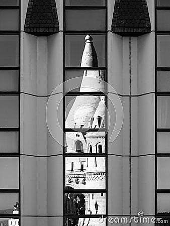 Reflection of Fisherman`s Bastion, aka Halaszbastya, fairy tale towers in modern hotel windows. Architectural contrast Stock Photo