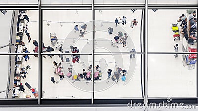 Reflection glass of top view people walk and sit in bench with l Editorial Stock Photo