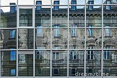 Reflection of a historic faÃ§ade from the Wilhelminian period in the modern, austere glass front of a high-rise building Stock Photo